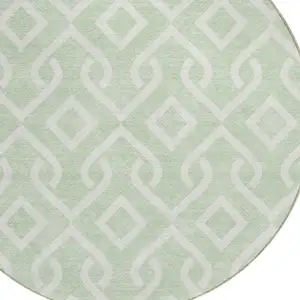 Photo of 8' Mint Green And Ivory Round Geometric Washable Indoor Outdoor Area Rug