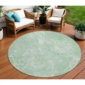 Photo of 8' Mint Green Sage And Ivory Round Abstract Washable Indoor Outdoor Area Rug