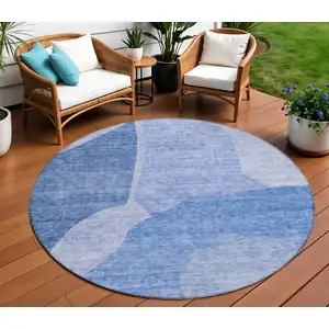 Photo of 8' Navy Blue And Denim Blue Round Abstract Washable Indoor Outdoor Area Rug