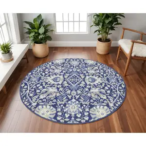 Photo of 8' Navy Blue Ivory and Beige Floral Round Rug