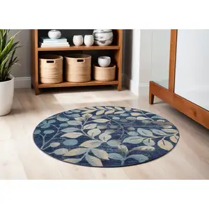 Photo of 5' Navy Blue and Beige Botanical Leaves Round Rug