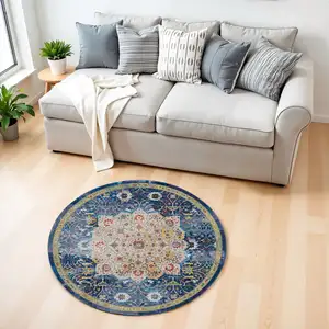 Photo of 4' Navy Blue and Gold Medallion Distressed Non Skid Round Rug