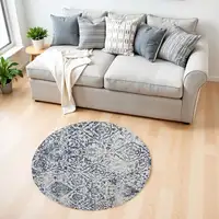 Photo of 4' Navy Blue and Ivory Damask Distressed Round Rug