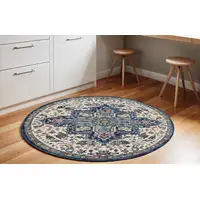 Photo of 6' Navy Blue and Ivory Floral Medallion Distressed Non Skid Round Rug