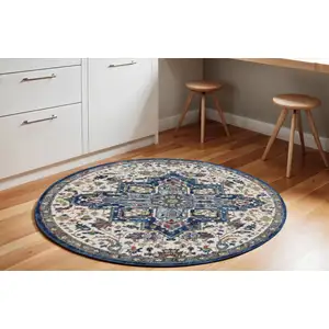 Photo of 6' Navy Blue and Ivory Floral Medallion Distressed Non Skid Round Rug