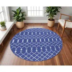 Photo of 8' Navy Blue and Ivory Geometric Round Rug