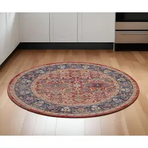 Photo of 6' Navy Blue and Red Floral Distressed Non Skid Round Rug