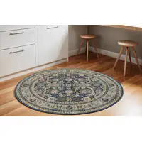 Photo of 6' Navy Blue and Yellow Floral Distressed Non Skid Round Rug