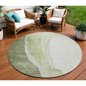 Photo of 8' Olive Green And Beige Round Abstract Washable Indoor Outdoor Area Rug