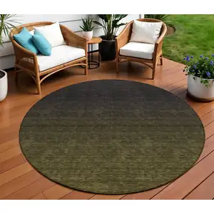 Photo of 8' Olive Green And Charcoal Round Abstract Washable Indoor Outdoor Area Rug