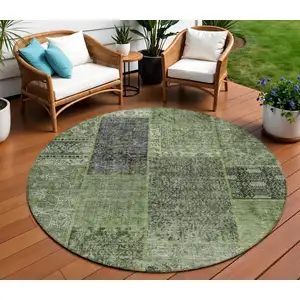 Photo of 8' Olive Green And Gray Round Patchwork Washable Indoor Outdoor Area Rug