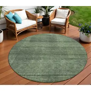 Photo of 8' Olive Green And Gray Round Striped Washable Indoor Outdoor Area Rug