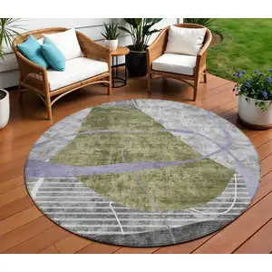 Photo of 8' Olive Green Gray And Charcoal Round Abstract Washable Indoor Outdoor Area Rug