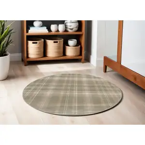 Photo of 4' Olive Green and Ivory Plaid Round Rug