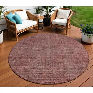 Photo of 8' Orange And Copper Round Southwestern Washable Indoor Outdoor Area Rug