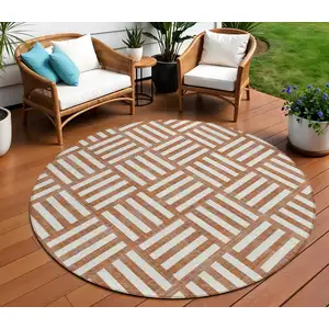 Photo of 8' Orange And Ivory Round Geometric Washable Indoor Outdoor Area Rug