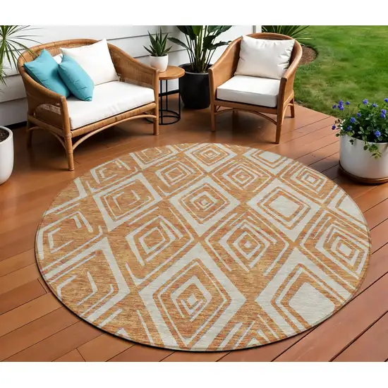 8' Orange And Ivory Round Geometric Washable Indoor Outdoor Area Rug Photo 1