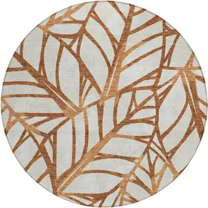 Photo of 8' Orange Beige And Copper Round Floral Washable Indoor Outdoor Area Rug