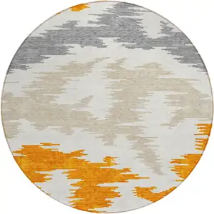 Photo of 8' Orange Beige And Ivory Round Abstract Washable Indoor Outdoor Area Rug