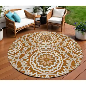 Photo of 8' Orange Copper And Beige Round Floral Medallion Washable Indoor Outdoor Area Rug