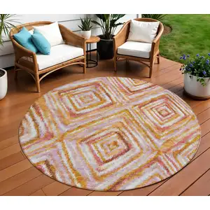 Photo of 8' Orange Copper And Gold Round Geometric Washable Indoor Outdoor Area Rug