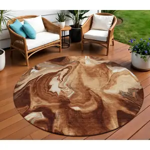 Photo of 8' Orange Copper And Ivory Round Abstract Washable Indoor Outdoor Area Rug