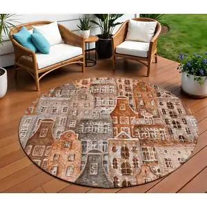 Photo of 8' Orange Copper And Salmon Round Village Houses Washable Indoor Outdoor Area Rug