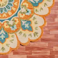 Photo of 4' Orange and Blue Round Wool Floral Hand Tufted Area Rug