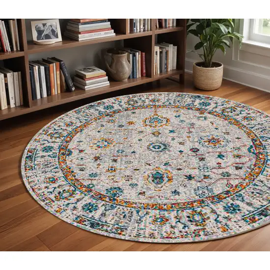 7' Orange and Ivory Floral Power Loom Round Rug Photo 1