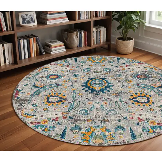 7' Orange and Ivory Floral Power Loom Round Rug Photo 1