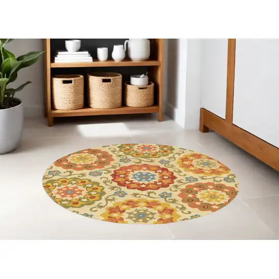 6' Orange and Ivory Round Wool Floral Hand Tufted Area Rug Photo 1