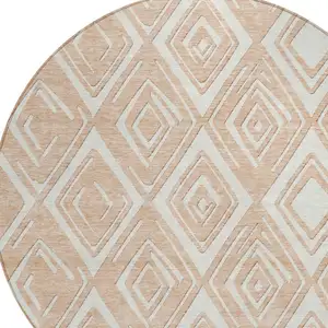 Photo of 8' Peach And Ivory Round Geometric Washable Indoor Outdoor Area Rug