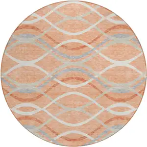 Photo of 8' Peach Orange And Gray Round Abstract Washable Indoor Outdoor Area Rug