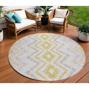 Photo of 8' Pearl Ivory And Artichoke Green Round Geometric Washable Indoor Outdoor Area Rug