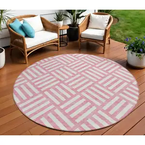 Photo of 8' Pink And Ivory Round Geometric Washable Indoor Outdoor Area Rug