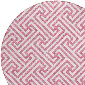 Photo of 8' Pink And Ivory Round Geometric Washable Indoor Outdoor Area Rug