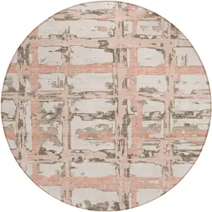 Photo of 8' Pink Beige And Taupe Round Striped Washable Indoor Outdoor Area Rug