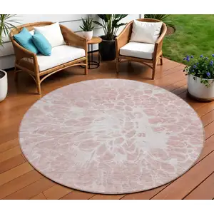 Photo of 8' Pink Blush And Ivory Round Abstract Washable Indoor Outdoor Area Rug