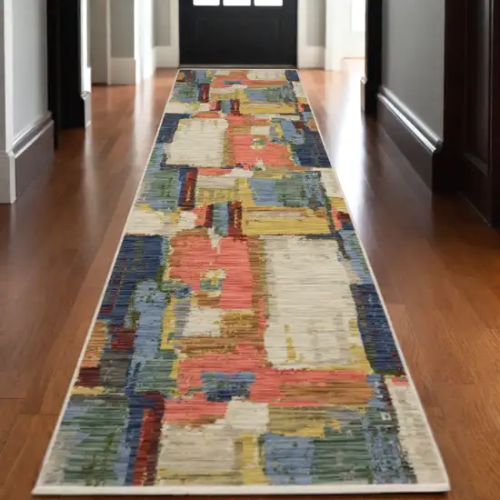 12' Pink Yellow And Dark Blue Abstract Runner Rug With Fringe Photo 1