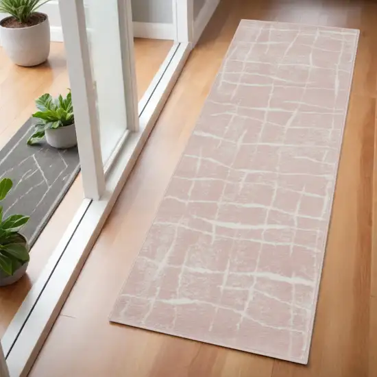 6' Pink and Ivory Abstract Geometric Runner Rug Photo 1