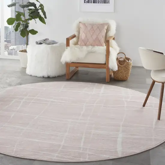 8' Pink and Ivory Abstract Round Rug Photo 9