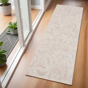 Photo of 6' Pink and Ivory Floral Distressed Runner Rug