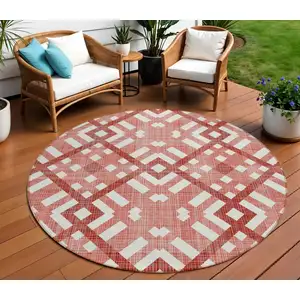 Photo of 8' Red And Ivory Round Geometric Washable Indoor Outdoor Area Rug