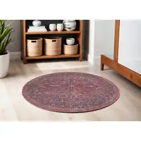 Photo of 5' Red Round Floral Power Loom Distressed Area Rug