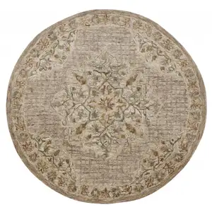 Photo of 4' Round Beige Distressed Medallion Area Rug