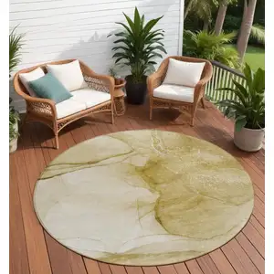 Photo of 8' Round Beige Round Abstract Washable Non Skid Indoor Outdoor Area Rug