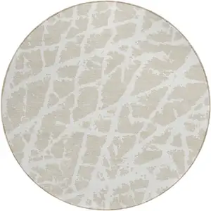 Photo of 8' Round Beige and Ivory Round Abstract Washable Non Skid Indoor Outdoor Area Rug