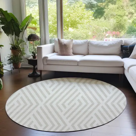 8' Round Beige and Ivory Round Geometric Washable Non Skid Indoor Outdoor Area Rug Photo 9