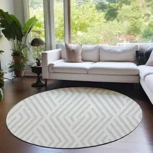 Photo of 8' Round Beige and Ivory Round Geometric Washable Non Skid Indoor Outdoor Area Rug