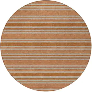 Photo of 8' Round Beige and Orange Round Striped Washable Non Skid Indoor Outdoor Area Rug